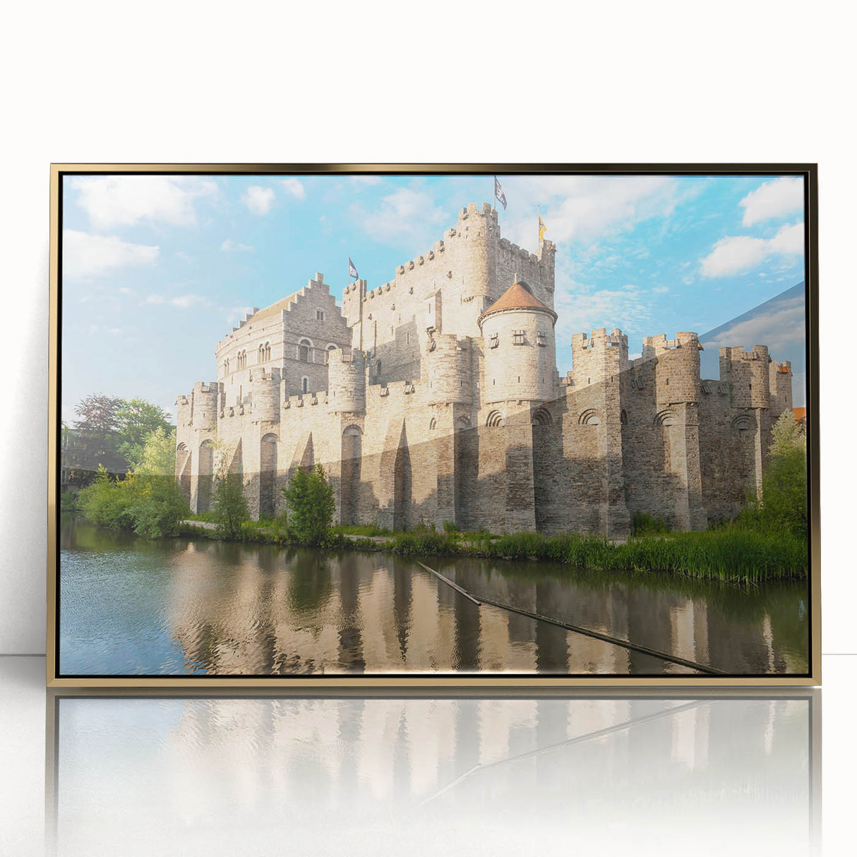 Framed wall art showcasing a picturesque landscape with a majestic castle, featuring a gold-acrylic front that enhances its vibrant colors, perfect for home decor.