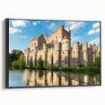 Framed canvas wall art showcasing a picturesque landscape with a majestic castle, set against a serene background; features a sleek black frame, perfect for home decor.