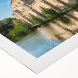 Vibrant rolled canvas showcasing a stunning landscape view of a majestic castle surrounded by lush greenery, ideal for home decor and art enthusiasts.