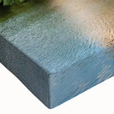 Close-up of a stretched canvas featuring a vibrant landscape with a majestic castle, showcasing intricate details and rich colors, ideal for home decor.