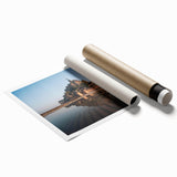 Rolled print of a scenic landscape featuring an enchanting castle surrounded by lush greenery and a vibrant sky, perfect for home decor enthusiasts.