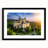 Framed wall art showcasing a stunning landscape castle design with a black mat, perfect for enhancing home decor and adding a touch of elegance.