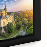 Framed canvas close-up of a picturesque landscape showcasing a majestic castle, surrounded by vibrant greenery and a clear blue sky, perfect for home decor.