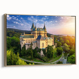 Framed canvas wall art of a majestic castle landscape, featuring rich gold accents and intricate detailing, elegantly displayed from a side view. The artwork captures a serene atmosphere, perfect for home decor enthusiasts.