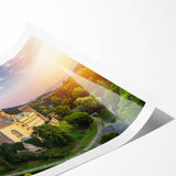 Rolled print showcasing a stunning landscape of a medieval castle surrounded by lush greenery, ideal for home decor or art collectors, presented in a durable tube.