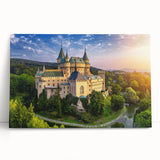 Stretched canvas wall art showcasing a picturesque landscape with a majestic castle, featuring vibrant colors and intricate details, perfect for home decor enhancement.