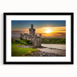 Framed wall art featuring a picturesque castle landscape design, showcased in a sleek black frame with a white mat, perfect for enhancing home décor.