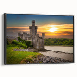 Framed canvas wall art showcasing a picturesque castle landscape design, featuring vibrant colors and intricate details, set against a sleek black frame for a modern touch.