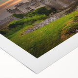 Rolled canvas artwork showcasing a vibrant landscape with a majestic castle set against a scenic backdrop of rolling hills and a clear blue sky. Perfect for home decor.