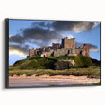 Framed canvas wall art depicting a stunning landscape with a castle set against a vibrant sunset. The black frame adds elegance, perfect for home decor.