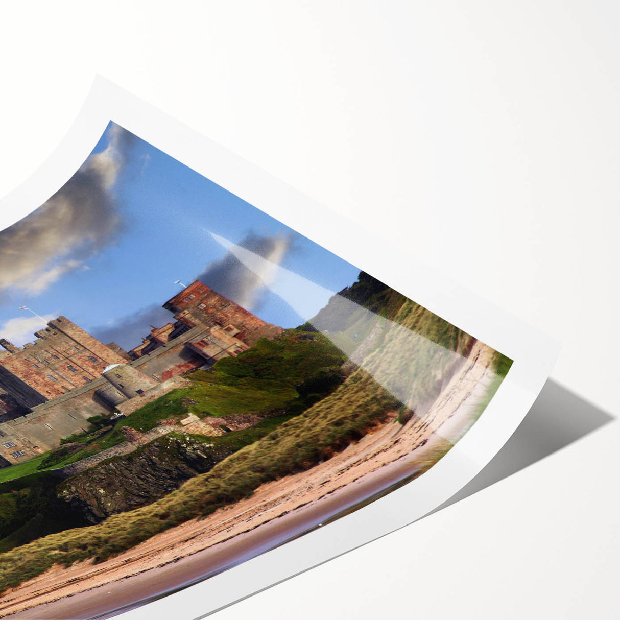 Rolled print showcasing a vibrant landscape with a majestic castle under a blue sky, ideal for home decor and wall art enthusiasts. Packaged securely in a protective tube.