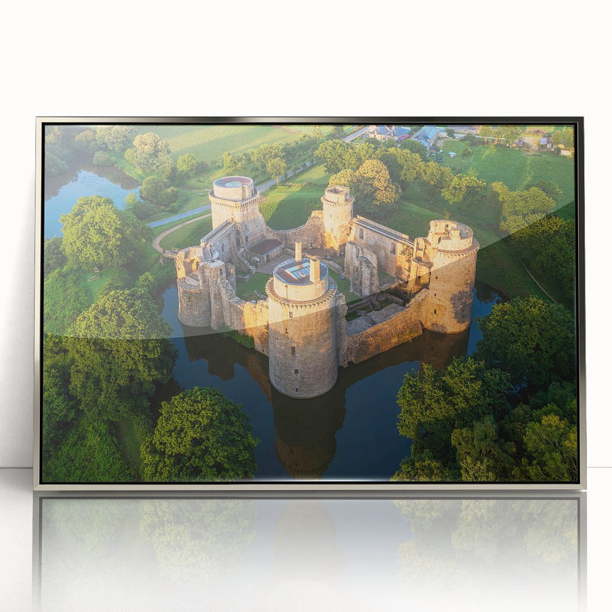 Framed wall art collection showcasing a stunning landscape with a castle, featuring a silver-acrylic frame that enhances the artwork's elegance. Ideal for home decor.