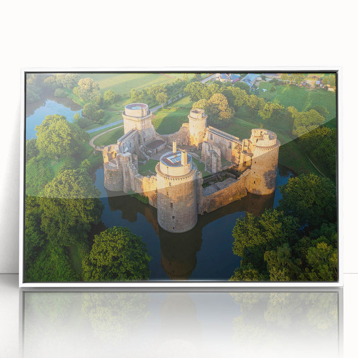 Framed acrylic wall art showcasing a stunning landscape of a castle, featuring vibrant colors and intricate details, set against a white backdrop for elegant home decor.
