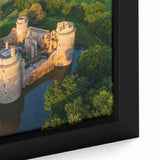 Close-up of a framed canvas wall art piece showcasing a vibrant landscape with a majestic castle, highlighting intricate details and rich colors, perfect for home decor.