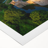 Rolled canvas art showcasing a stunning landscape of a castle set against a vibrant sunset, featuring rich colors and detailed textures, ideal for home decor.