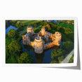 Scenic wall art print featuring a majestic castle surrounded by lush landscapes, rolled and ready for framing, showcasing vibrant colors and intricate details.