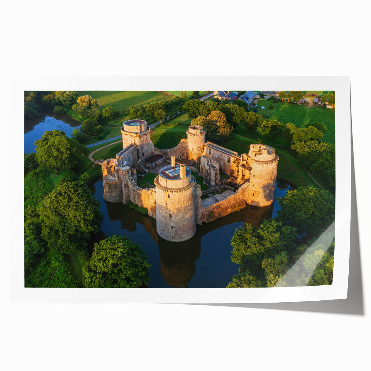 Scenic wall art print featuring a majestic castle surrounded by lush landscapes, rolled and ready for framing, showcasing vibrant colors and intricate details.