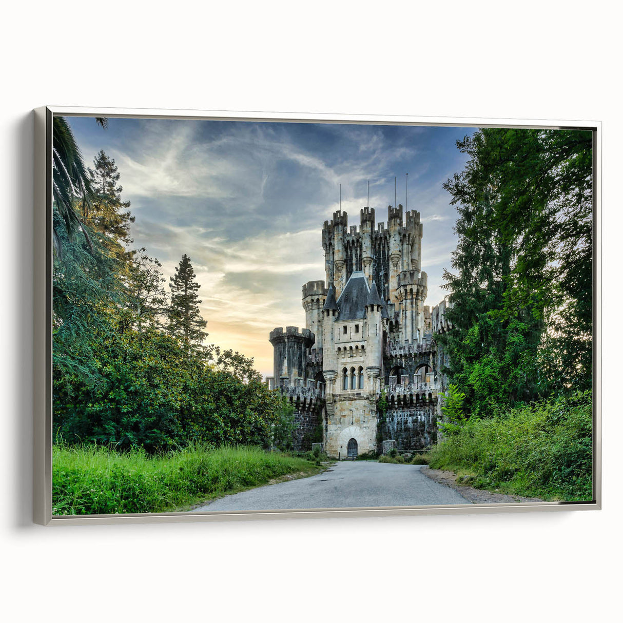 Framed wall art showcasing a serene landscape with a castle, complete with a silver frame. This elegant piece adds sophistication to any decor, ideal for enhancing living spaces.