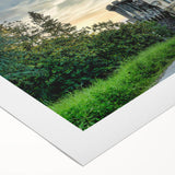Rolled canvas artwork showcasing a stunning landscape featuring a majestic castle surrounded by lush greenery and a vibrant sunset, perfect for home decor.