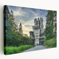 Stretched canvas wall art featuring a vibrant landscape of a castle surrounded by lush greenery, perfect for home decor. The artwork showcases intricate details and rich colors, creating an enchanting focal point for any room.