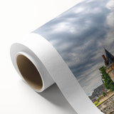 Rolled canvas art showcasing a stunning landscape castle design with vibrant colors, perfect for home decor. Packaged securely in a cardboard tube for shipping.