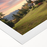 Vibrant rolled canvas artwork showcasing a scenic landscape with an intricate castle design, perfect for home decor or a gallery wall, securely packaged in a protective tube.