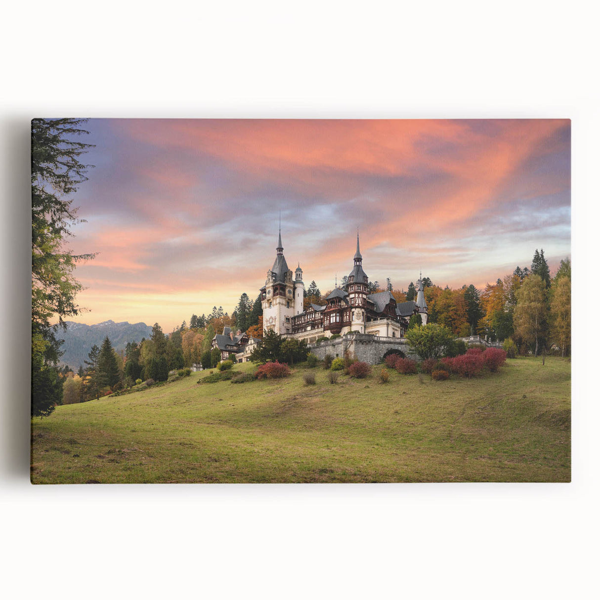 Stretched canvas artwork showcasing a vibrant landscape of a majestic castle, surrounded by lush greenery and a clear blue sky, perfect for home decor.