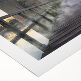 Rolled canvas artwork showcasing a vibrant landscape of a medieval castle surrounded by lush greenery, perfect for enhancing interior decor with a touch of history.