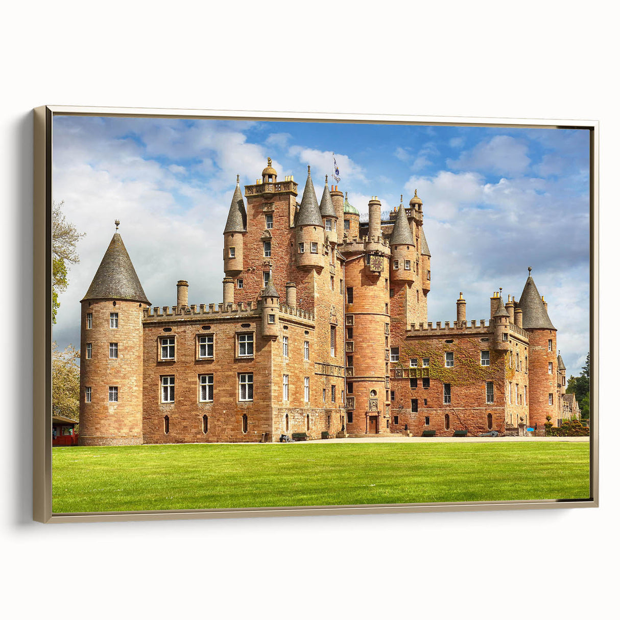 Framed canvas wall art showcasing a stunning landscape of a castle, featuring rich colors and intricate details, elegantly presented with a gold frame.