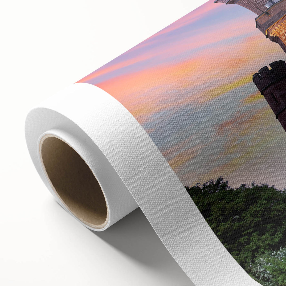 Rolled canvas artwork showcasing a vibrant landscape featuring a majestic castle surrounded by lush greenery and a clear blue sky, ideal for home decor.