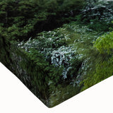 Close-up of a stretched canvas wall art piece featuring a vibrant landscape with a majestic castle, showcasing intricate details and rich colors, perfect for home decor.