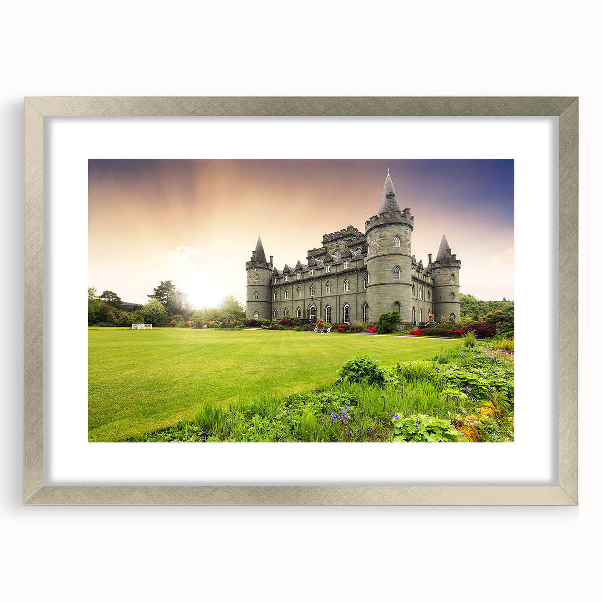 Framed landscape art print showcasing a majestic castle scene, elegantly matted and presented in a sleek silver frame, ideal for home decor enhancement.
