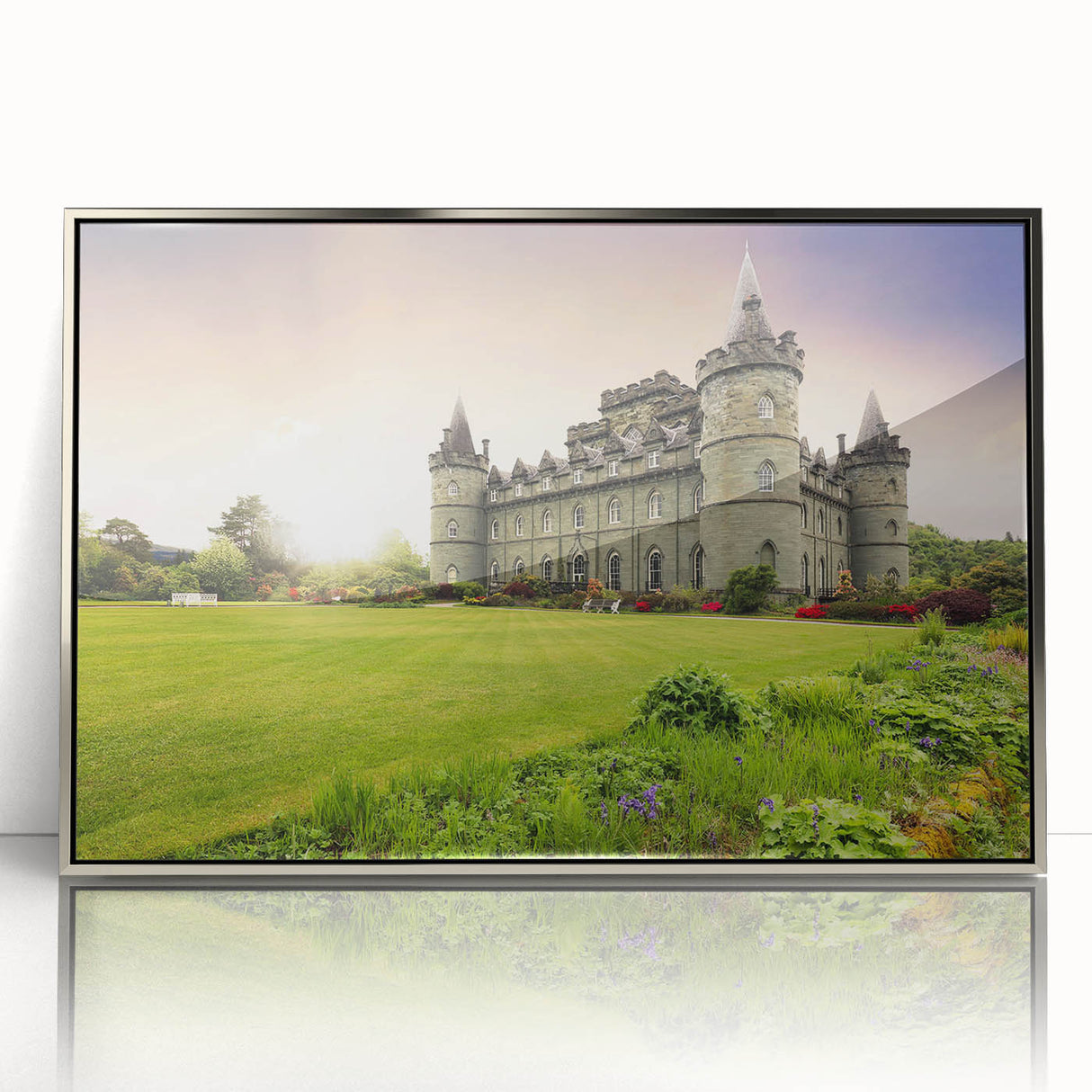 Framed wall art showcasing a stunning landscape of a castle against a serene sky, featuring silver-accented borders and an elegant design suitable for home decor.