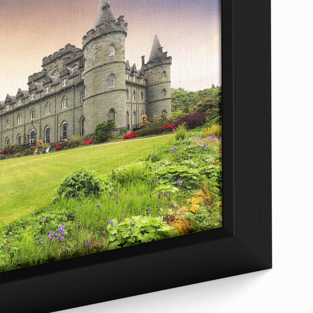 Framed canvas wall art showcasing a detailed landscape of a majestic castle surrounded by lush greenery, perfect for home decor enthusiasts and art collectors.