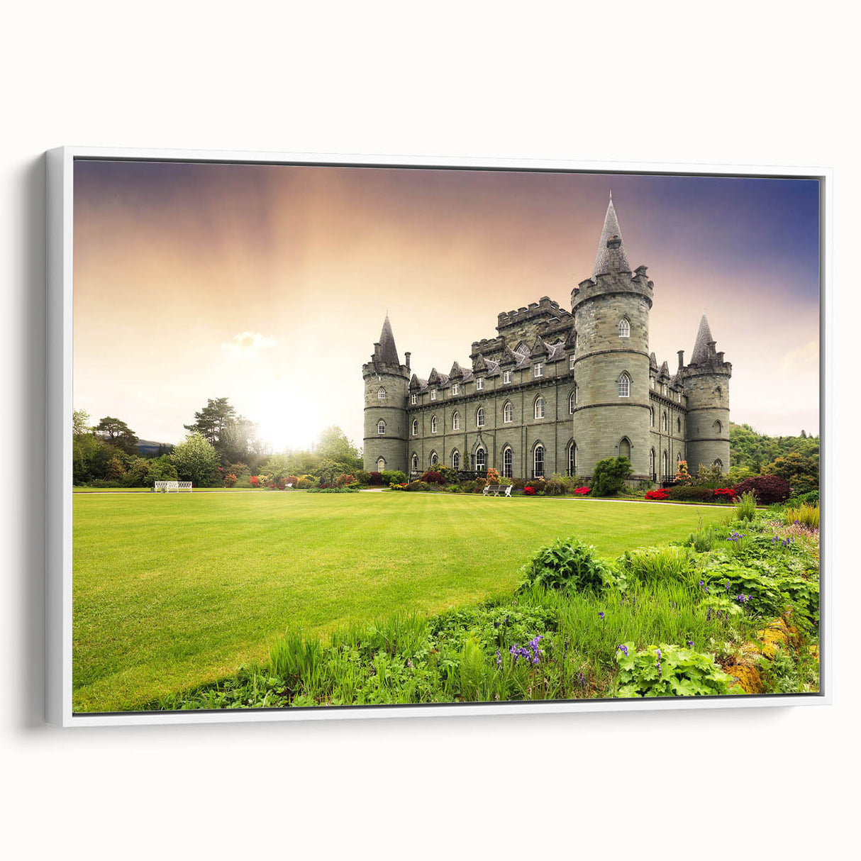 Framed canvas wall art showcasing a stunning landscape with a castle, presented in a sleek white frame and viewed from the side, ideal for home decor.