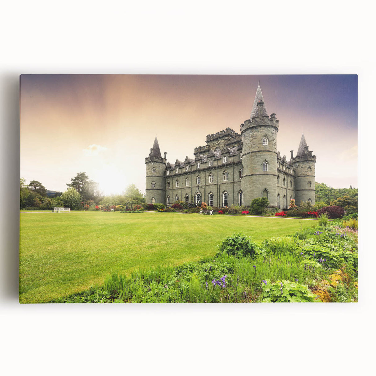 Stretched canvas artwork showcasing a vibrant landscape with a majestic castle, surrounded by lush greenery and a clear blue sky, perfect for home decor.