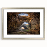Framed wall art collection featuring a stunning landscape design with cave imagery, elegantly presented in a silver frame with matting, ideal for home decor.