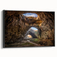 Framed canvas wall art showcasing a stunning landscape design featuring intricate caves, displayed from a side view with a sleek black frame, ideal for modern decor.