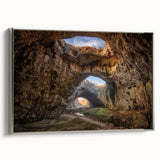 Framed canvas wall art showcasing a stunning landscape design with intricate cave details, elegantly presented with a silver frame, perfect for modern decor.