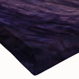 Close-up view of a stretched canvas featuring vibrant abstract cave landscape artwork with rich colors, ideal for home decor and artistic display.