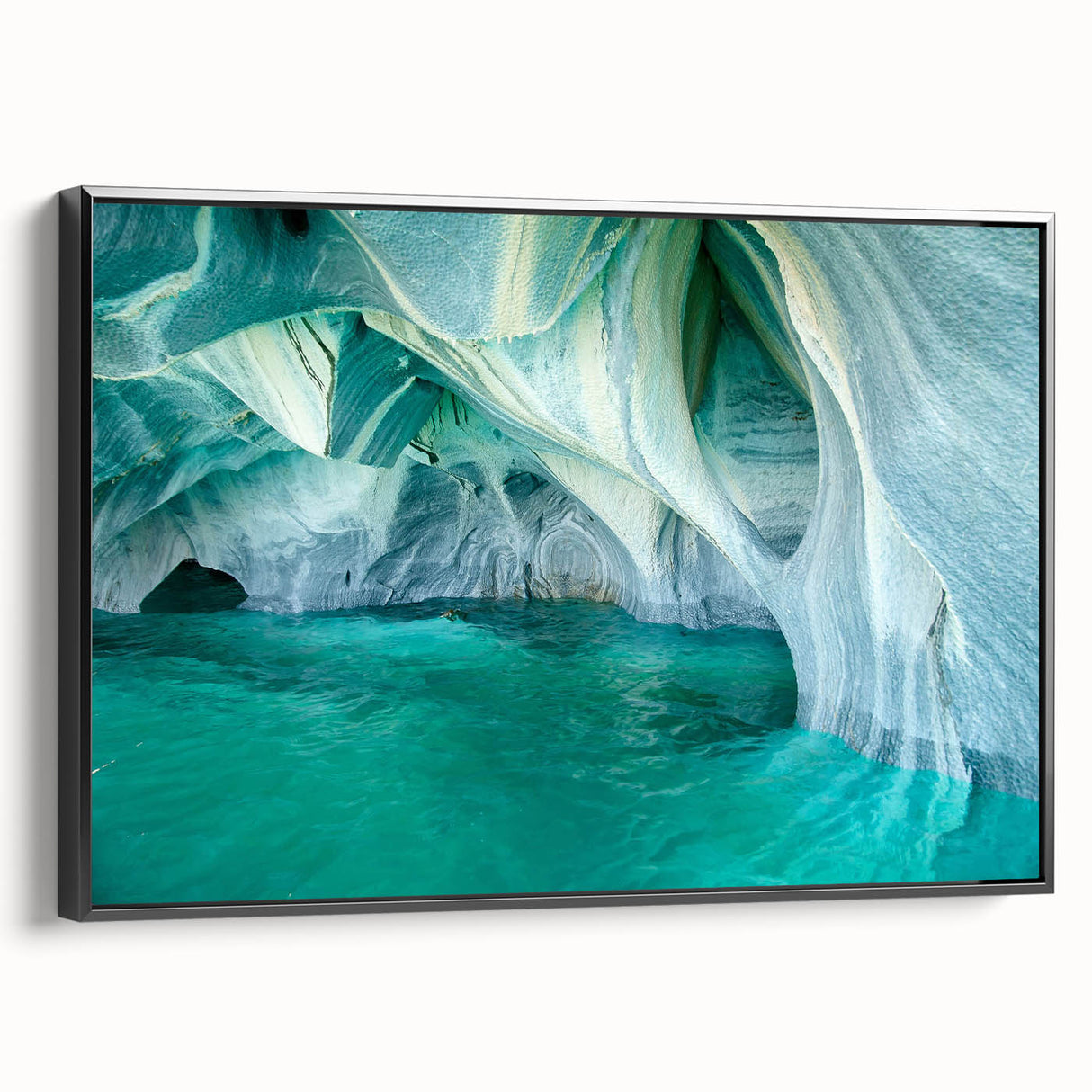 Framed canvas wall art showcasing a striking cave landscape design with vivid colors, set against a sleek black frame, perfect for modern decor.