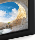 Framed canvas wall art showcasing a vibrant landscape scene with intricate cave designs, highlighting earthy tones and textured details for a captivating visual appeal.