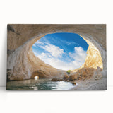 Stretched canvas wall art showcasing a serene landscape with vibrant cave formations, leaning against a wall. Perfect for modern home decor and artistic ambiance.