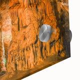 Close-up of a vibrant acrylic glass wall art piece showcasing intricate landscape and cave designs, perfect for modern home decor and artistic interiors.