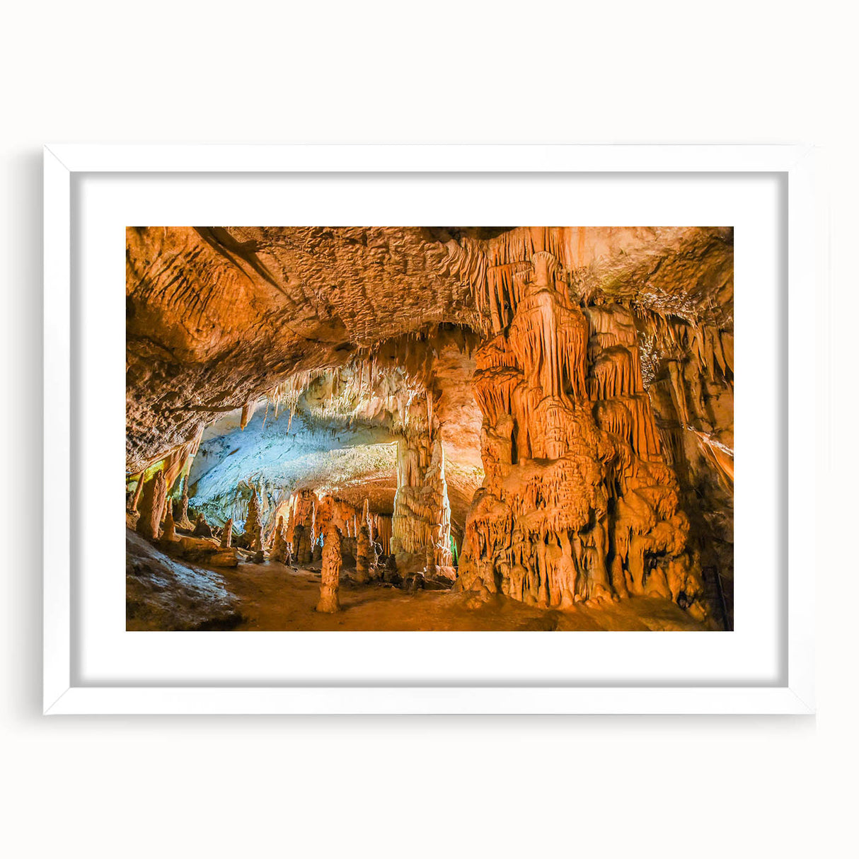 Framed wall art featuring a serene cave landscape design with natural earthy tones, set in a white mat and sleek frame, perfect for home decor.