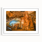 Framed wall art featuring a serene cave landscape design with natural earthy tones, set in a white mat and sleek frame, perfect for home decor.