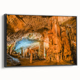 Framed canvas artwork showcasing a stunning landscape of caves with intricate details and vibrant colors, featuring a sleek black frame that enhances its elegance.