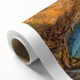 Rolled canvas artwork showcasing a vibrant landscape with cave formations and rich colors, ideal for adding a unique touch to home decor. Perfect for art enthusiasts.