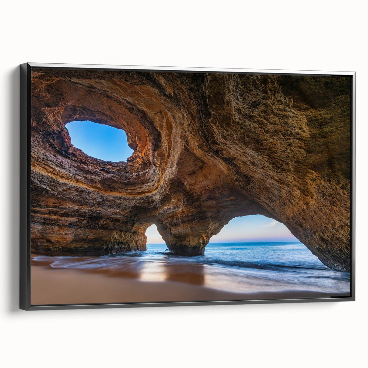 Framed canvas wall art showcasing a stunning landscape with cave designs in a black frame, perfect for modern home decor, emphasizing earthy tones and intricate details.