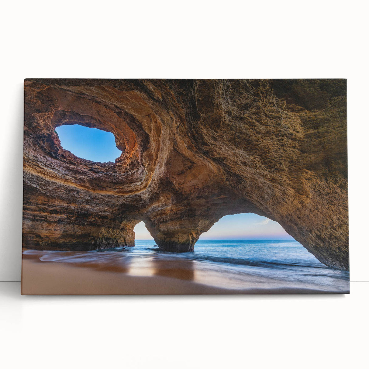Stretched canvas wall art showcasing a vibrant cave landscape design in earthy tones, perfect for adding a natural touch to home decor. This piece leans against a neutral background, enhancing its artistic appeal and inviting ambiance.